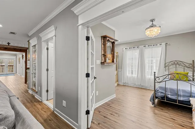 a view of a livingroom with furniture and hardwood floor
