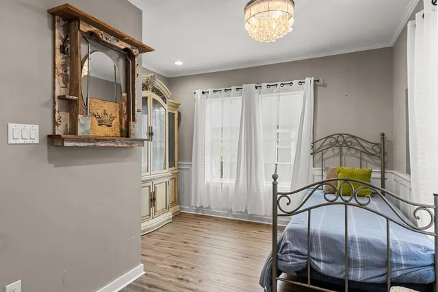 a view of a hallway with chandelier