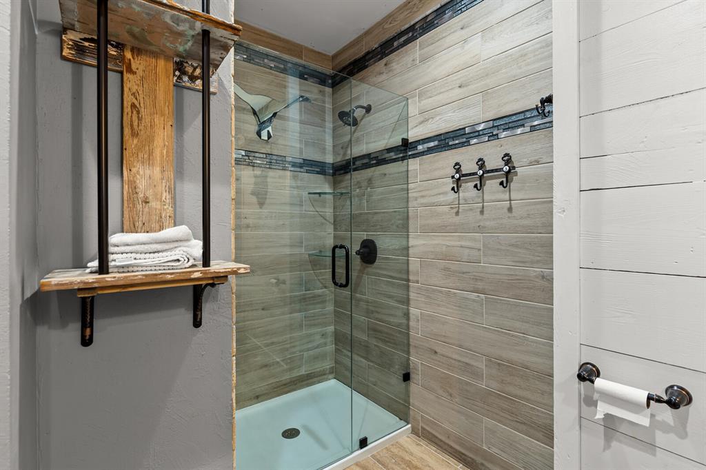 1815 South 12th Street Waco, TX 76706 - Photo 17 of 39 a bathroom with a shower and a sink