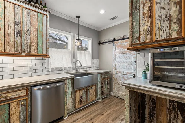 a kitchen with stainless steel appliances granite countertop a stove and a sink