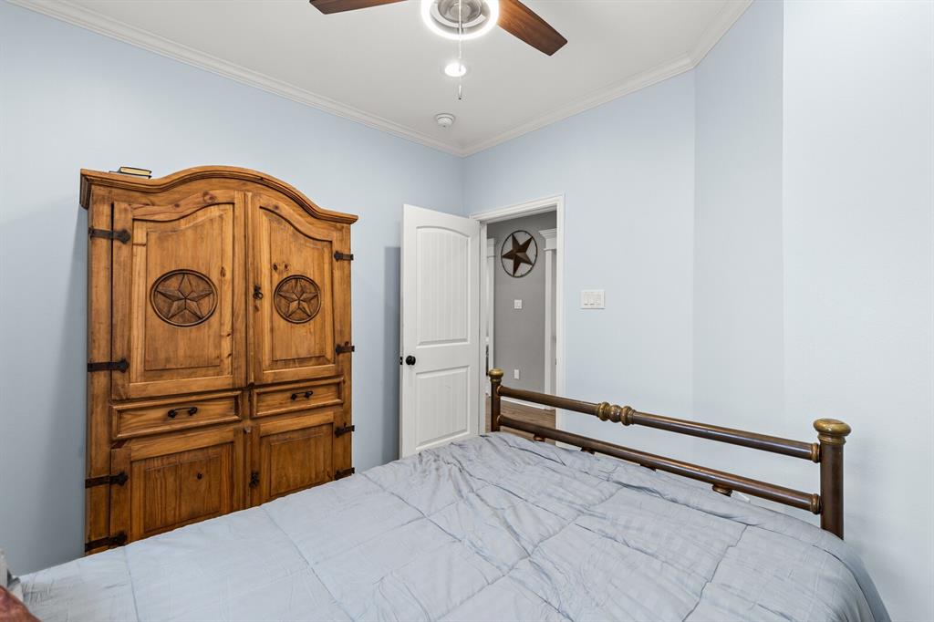 1815 South 12th Street Waco, TX 76706 - Photo 26 of 39 a bedroom with a bed and cabinets