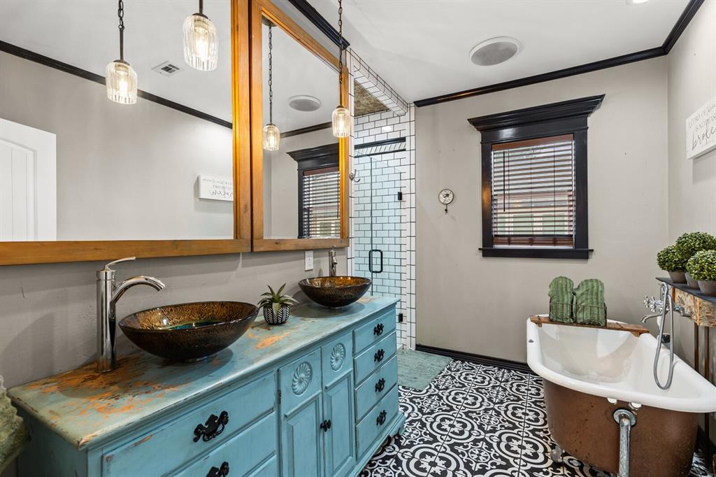 1815 South 12th Street Waco, TX 76706 - Photo 27 of 39 a bathroom with a sink and a mirror