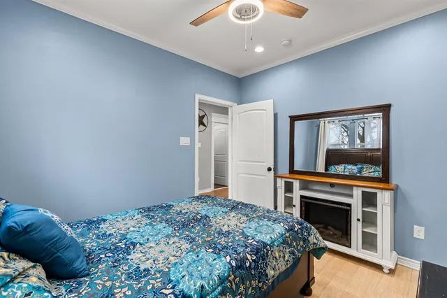 a bedroom with a bed and a fireplace