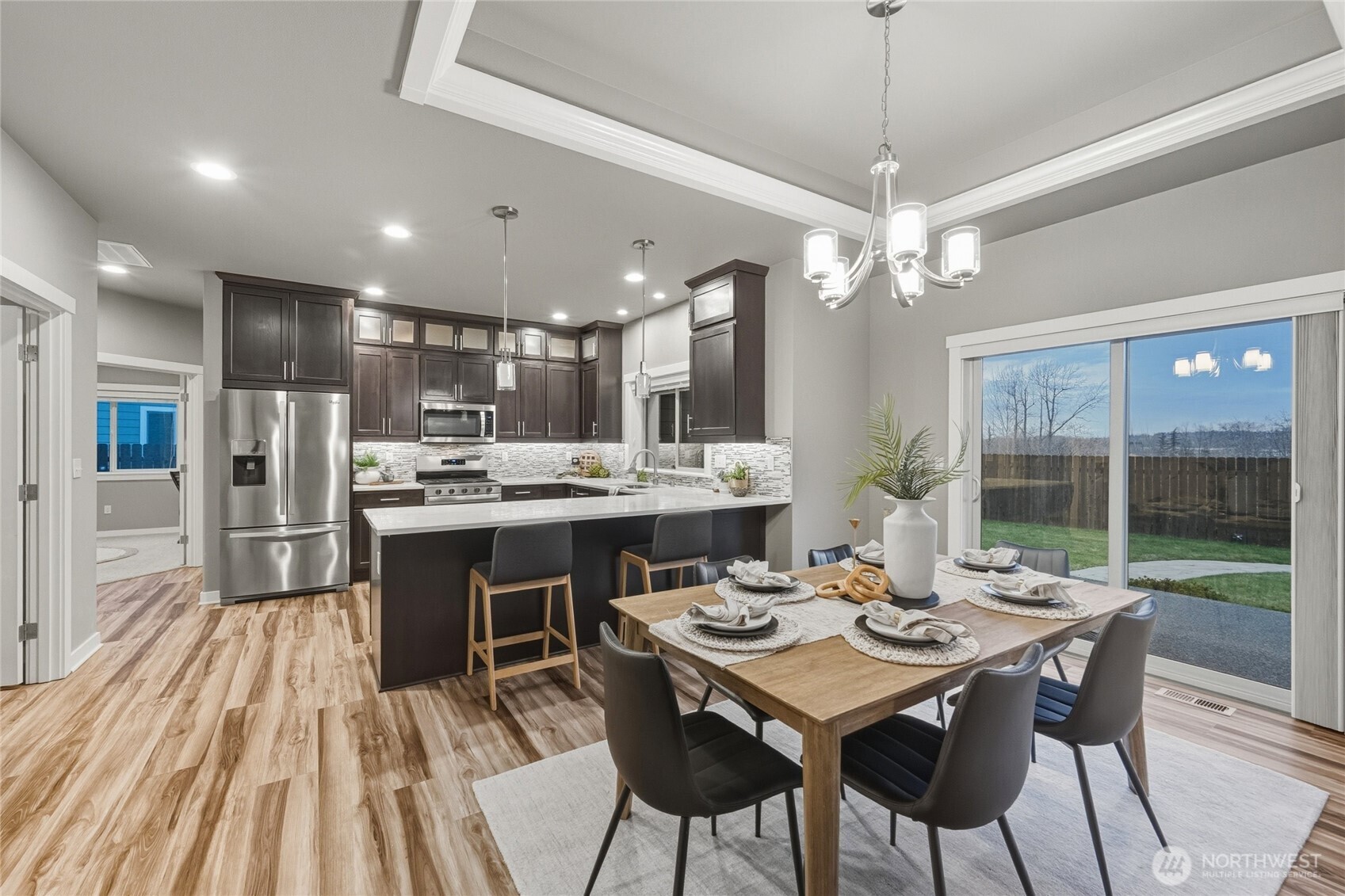 1476 Patriot Court Ferndale, WA 98248 - Photo 15 of 40 a view of a dining room with furniture window and wooden floor