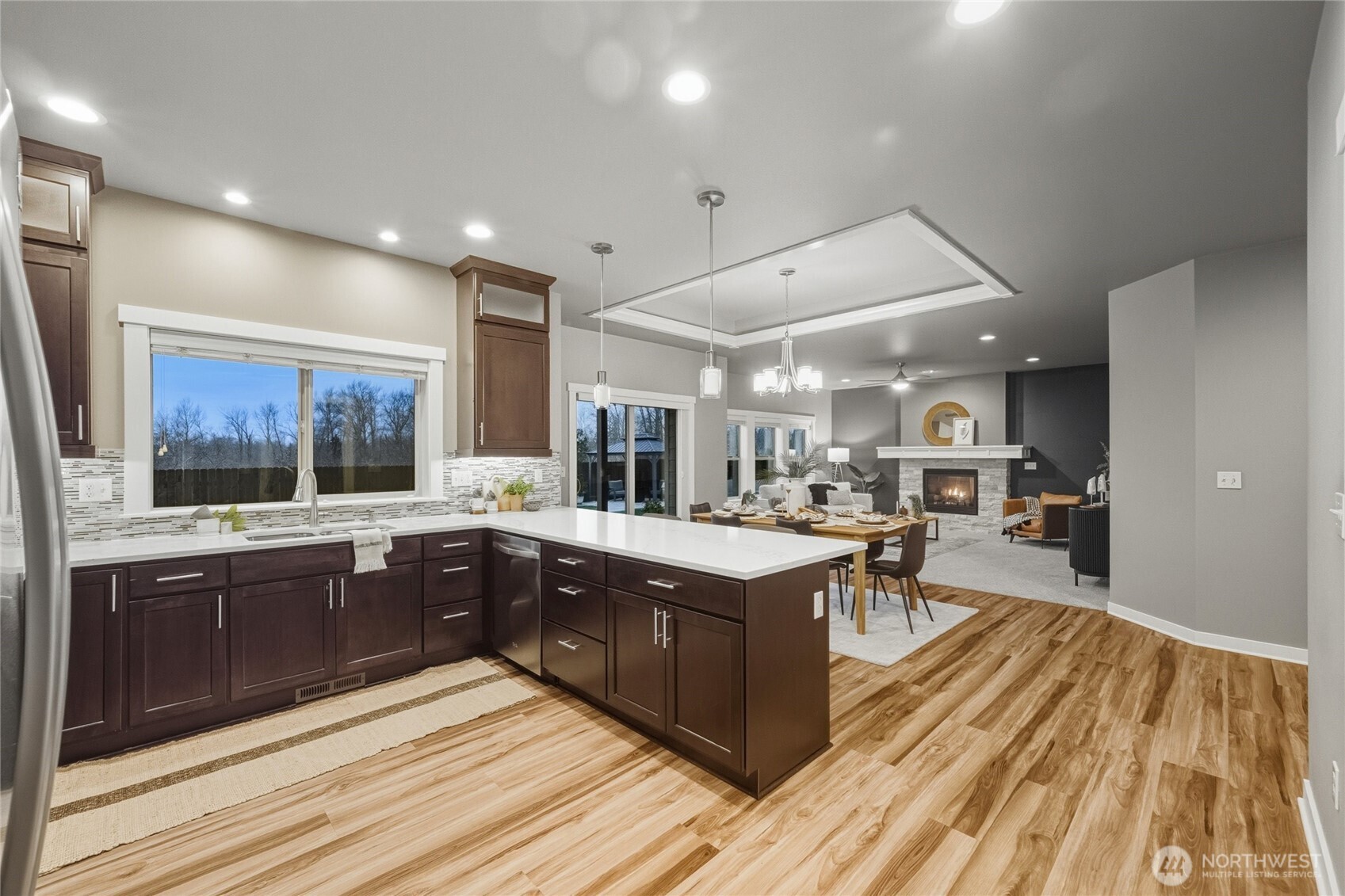 1476 Patriot Court Ferndale, WA 98248 - Photo 18 of 40 a large kitchen with wooden floor and stainless steel appliances