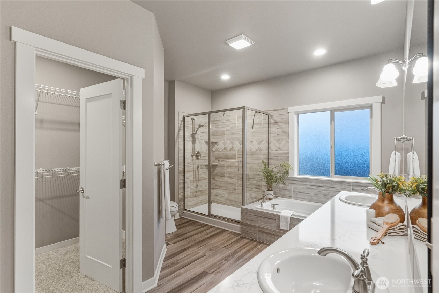 1476 Patriot Court Ferndale, WA 98248 - Photo 24 of 40 a spacious bathroom with a granite countertop sink a toilet and shower