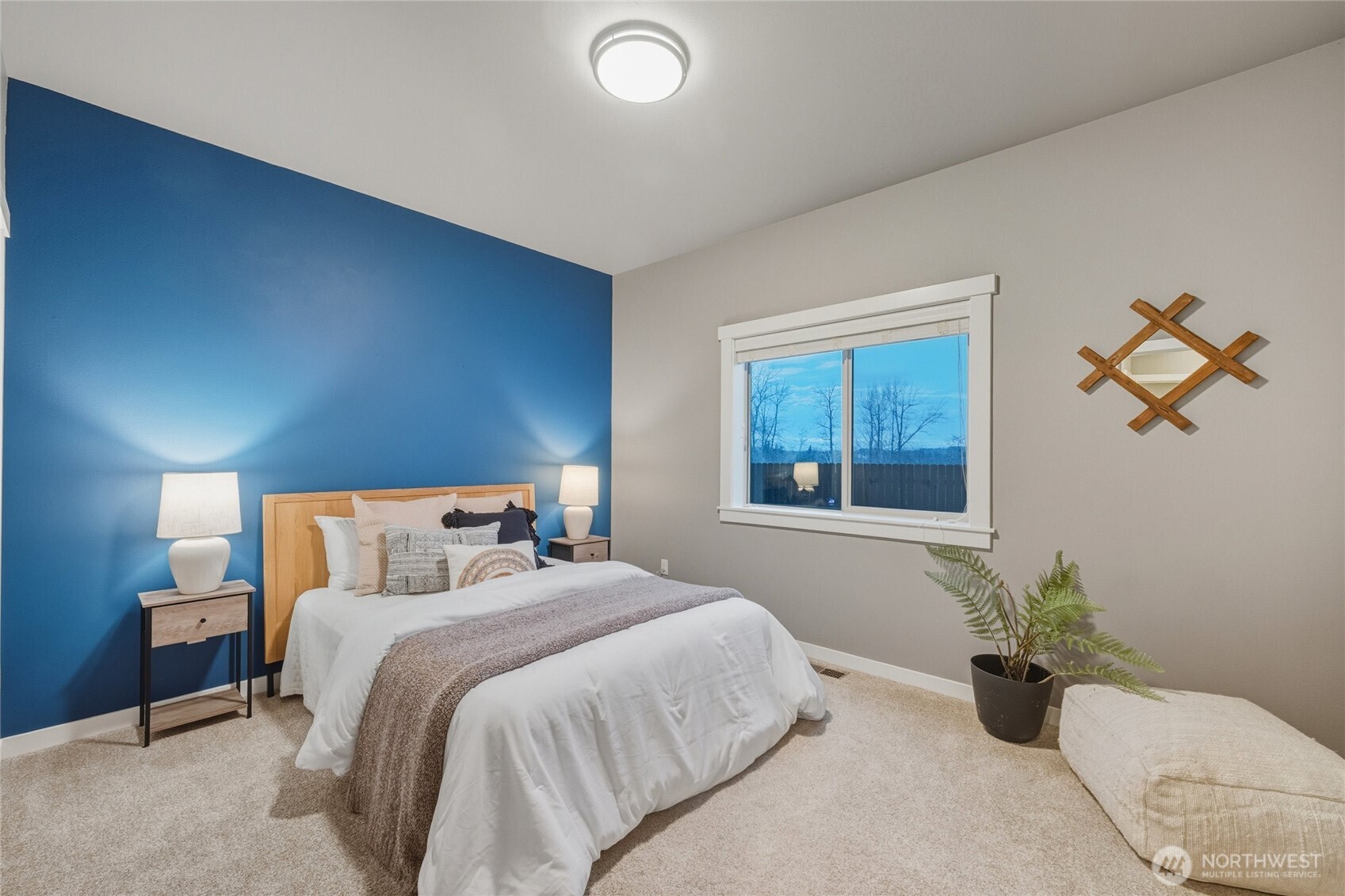 1476 Patriot Court Ferndale, WA 98248 - Photo 29 of 40 a bedroom with a bed and potted plant