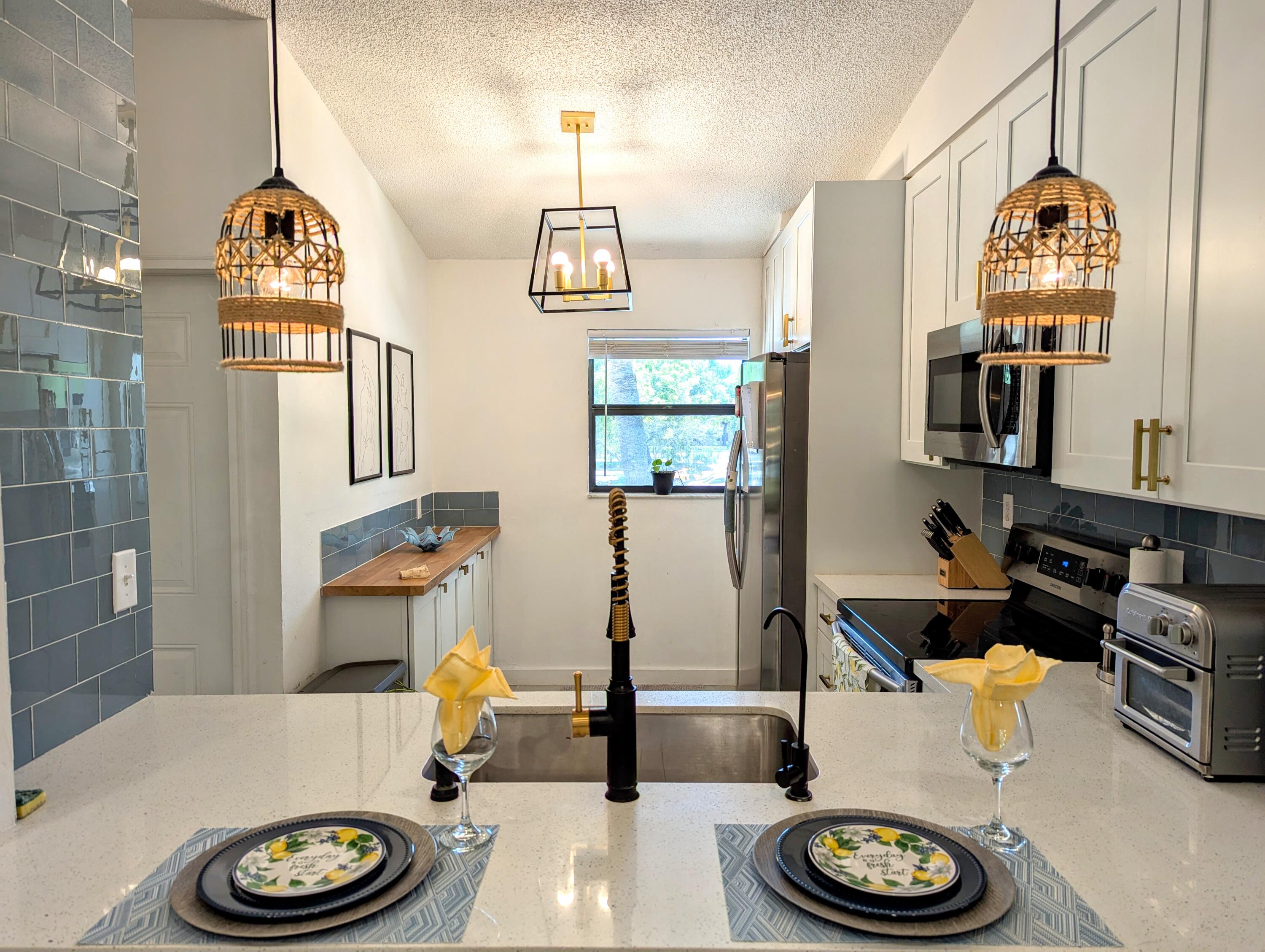 3130 Millwood Terrace, Unit 2160 Boca Raton, FL 33431 - Photo 5 of 34 Kitchen from Breakfast Bar