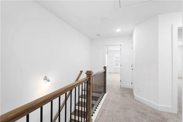 a view of a backyard with a wooden fence