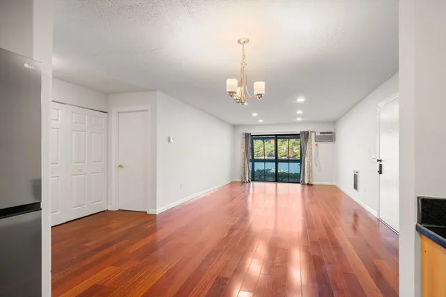 a view of a kitchen cabinets and wooden floor