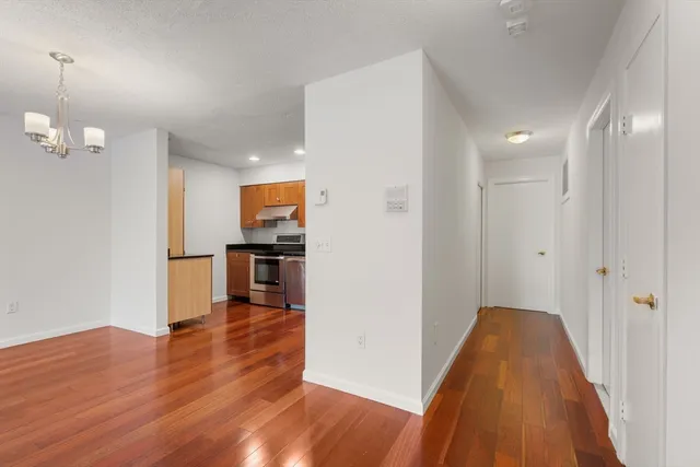 a view of a hallway with washer and dryer