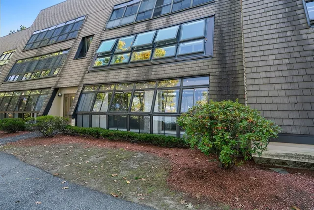 a view of a building next to a yard
