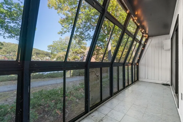 a view of a lake with a house in the background