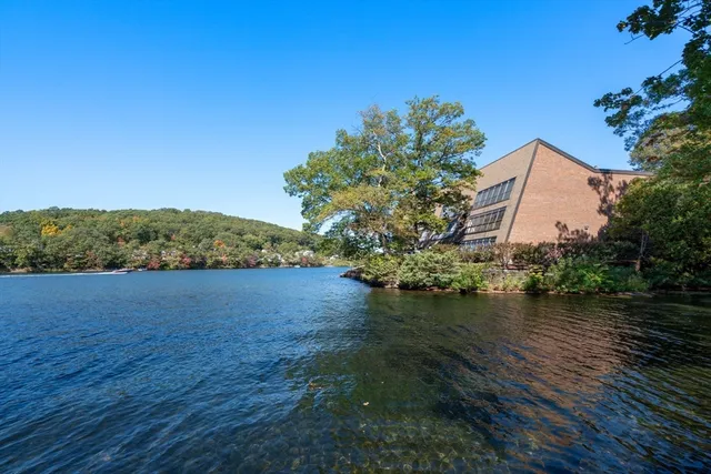 a view of a lake with a house in the background