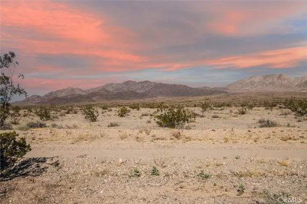a view of lake with mountain