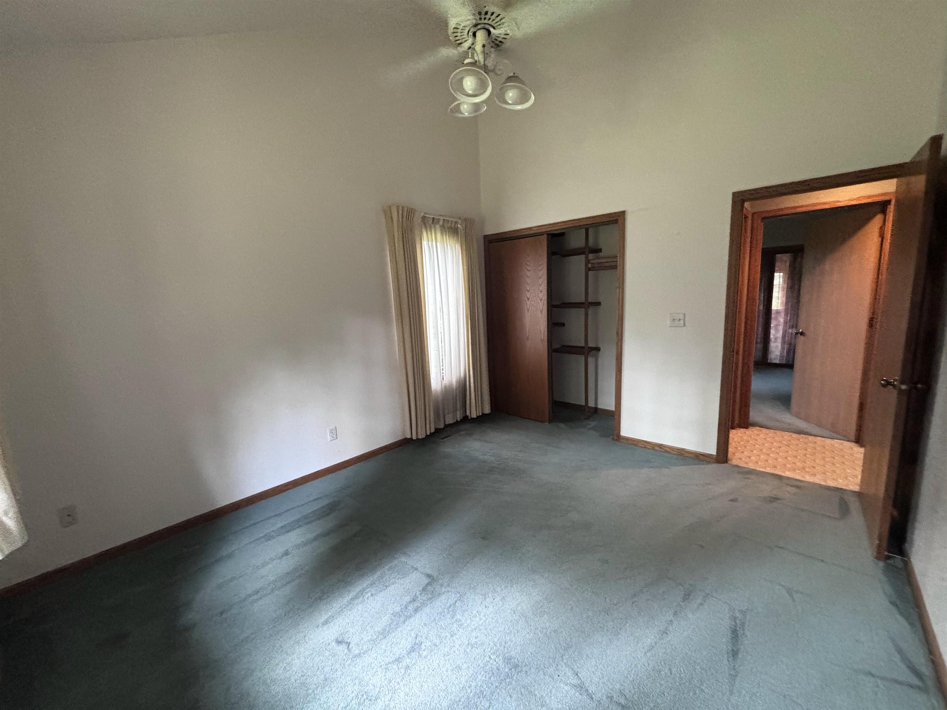 3543 Mill Road Cherry Valley, IL 61016 - Photo 13 of 46 an empty room with windows and closet