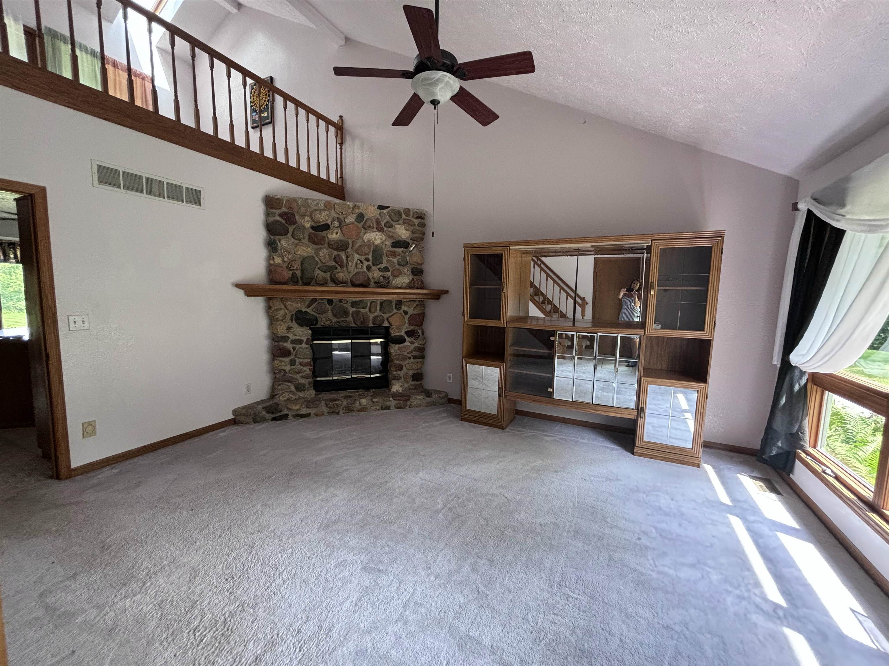 3543 Mill Road Cherry Valley, IL 61016 - Photo 2 of 46 a view of a livingroom with furniture and a ceiling fan