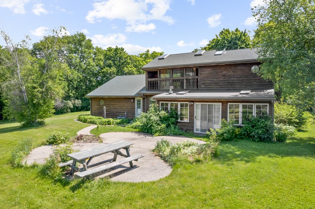 3543 Mill Road Cherry Valley, IL 61016 - Photo 24 of 46 a front view of a house with garden