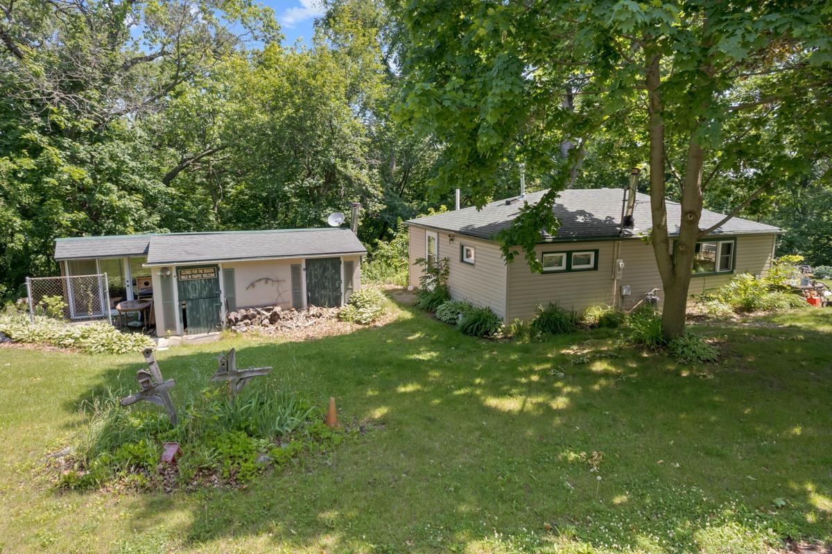 3543 Mill Road Cherry Valley, IL 61016 - Photo 27 of 46 a front view of house with yard and trees