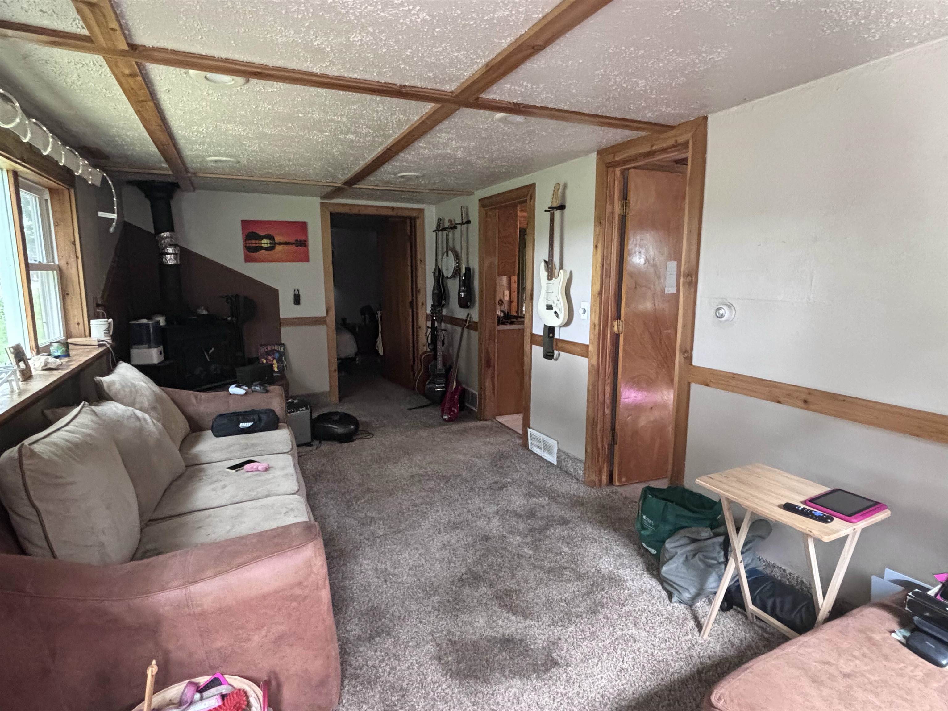 3543 Mill Road Cherry Valley, IL 61016 - Photo 29 of 46 a living room with furniture a flat screen tv and a window