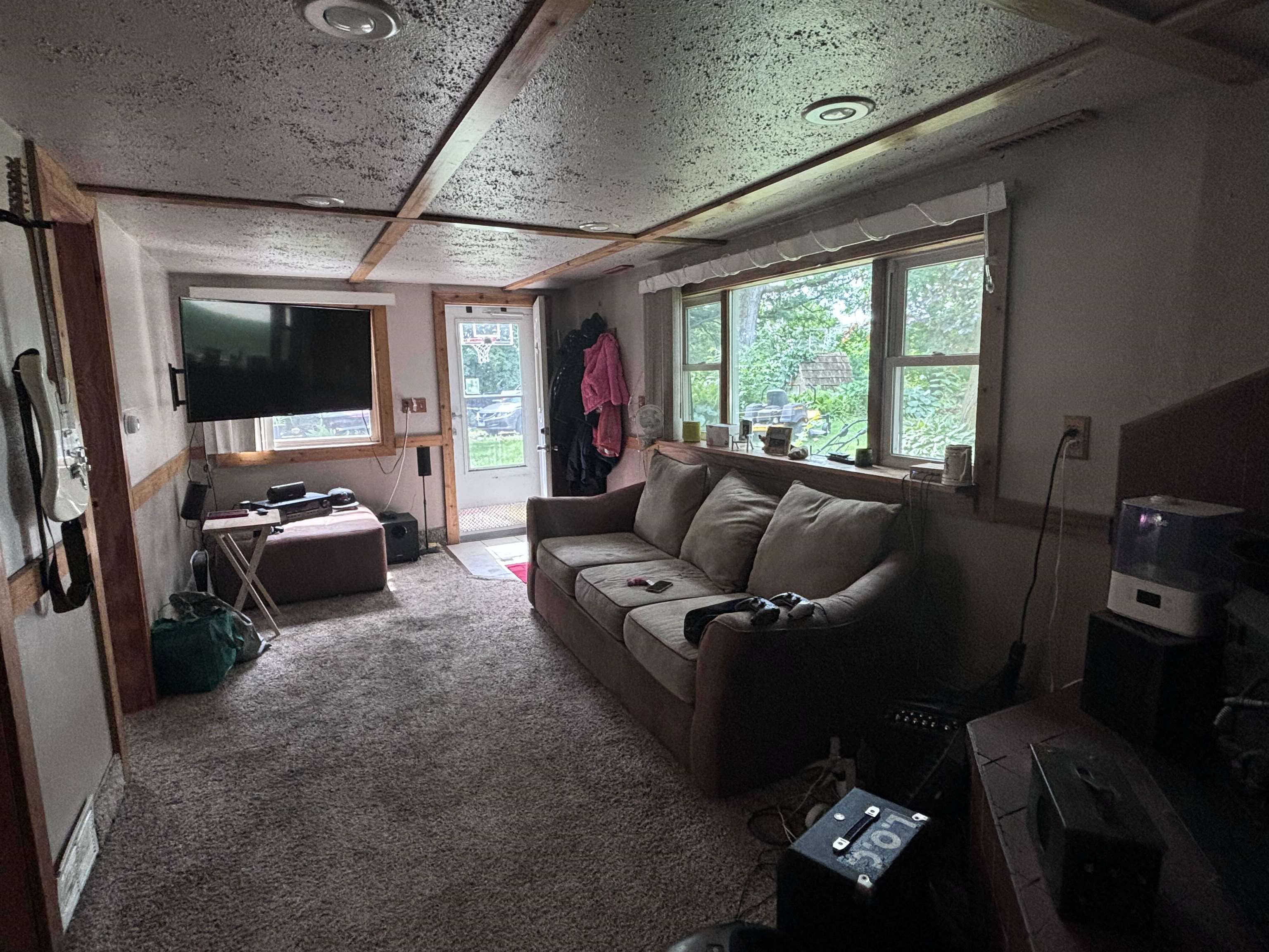 3543 Mill Road Cherry Valley, IL 61016 - Photo 30 of 46 a living room with furniture and a flat screen tv