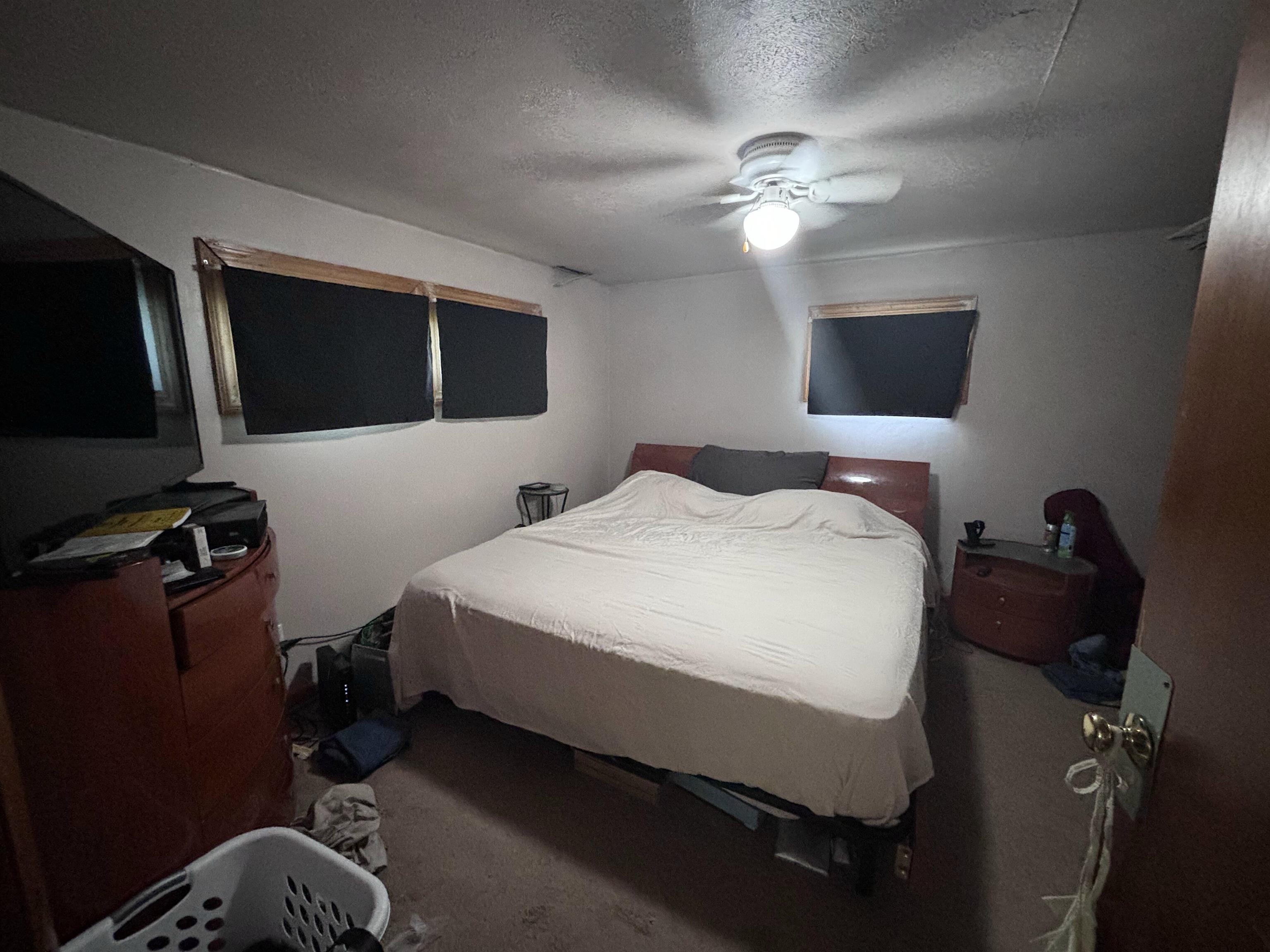 3543 Mill Road Cherry Valley, IL 61016 - Photo 31 of 46 a bedroom with a bed and a chandelier