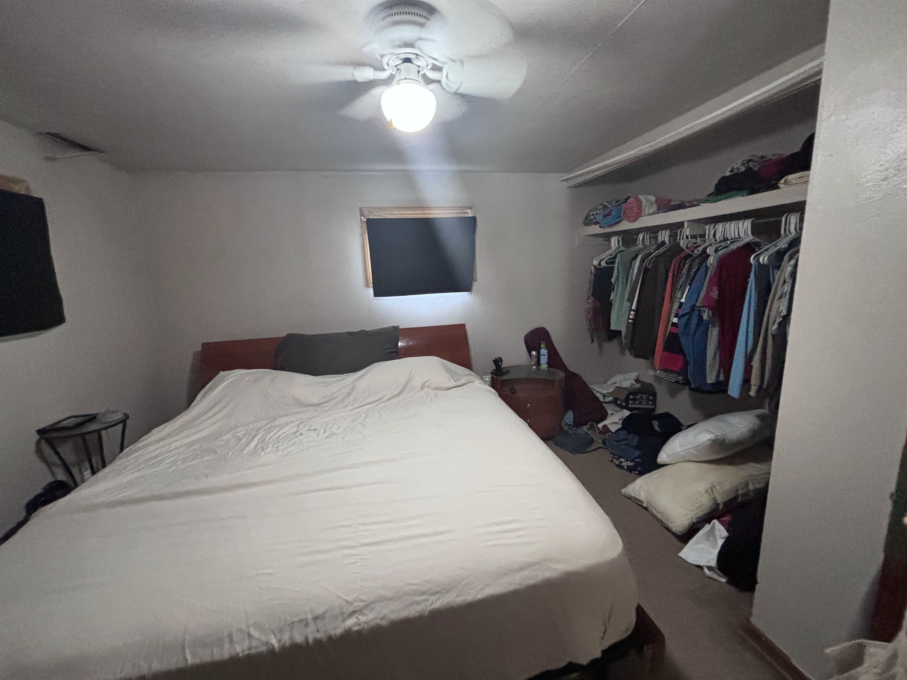 3543 Mill Road Cherry Valley, IL 61016 - Photo 32 of 46 a bedroom with a bed and a chandelier