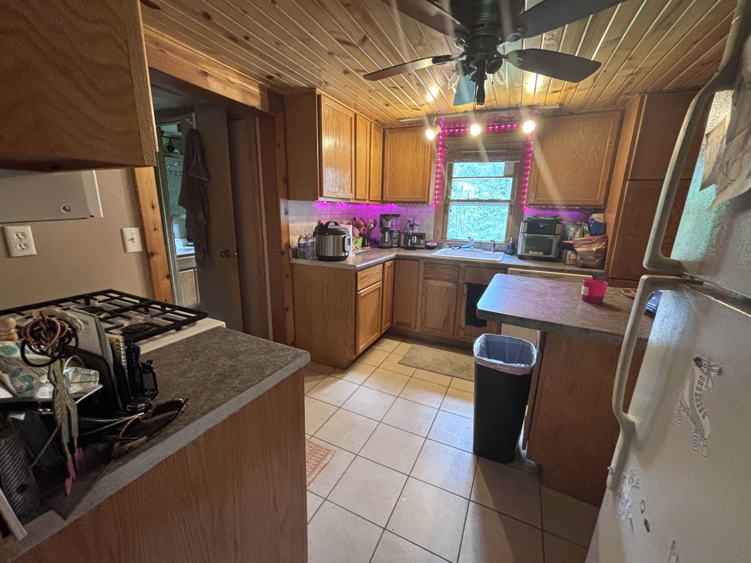 3543 Mill Road Cherry Valley, IL 61016 - Photo 34 of 46 a kitchen with stainless steel appliances granite countertop a sink and a stove
