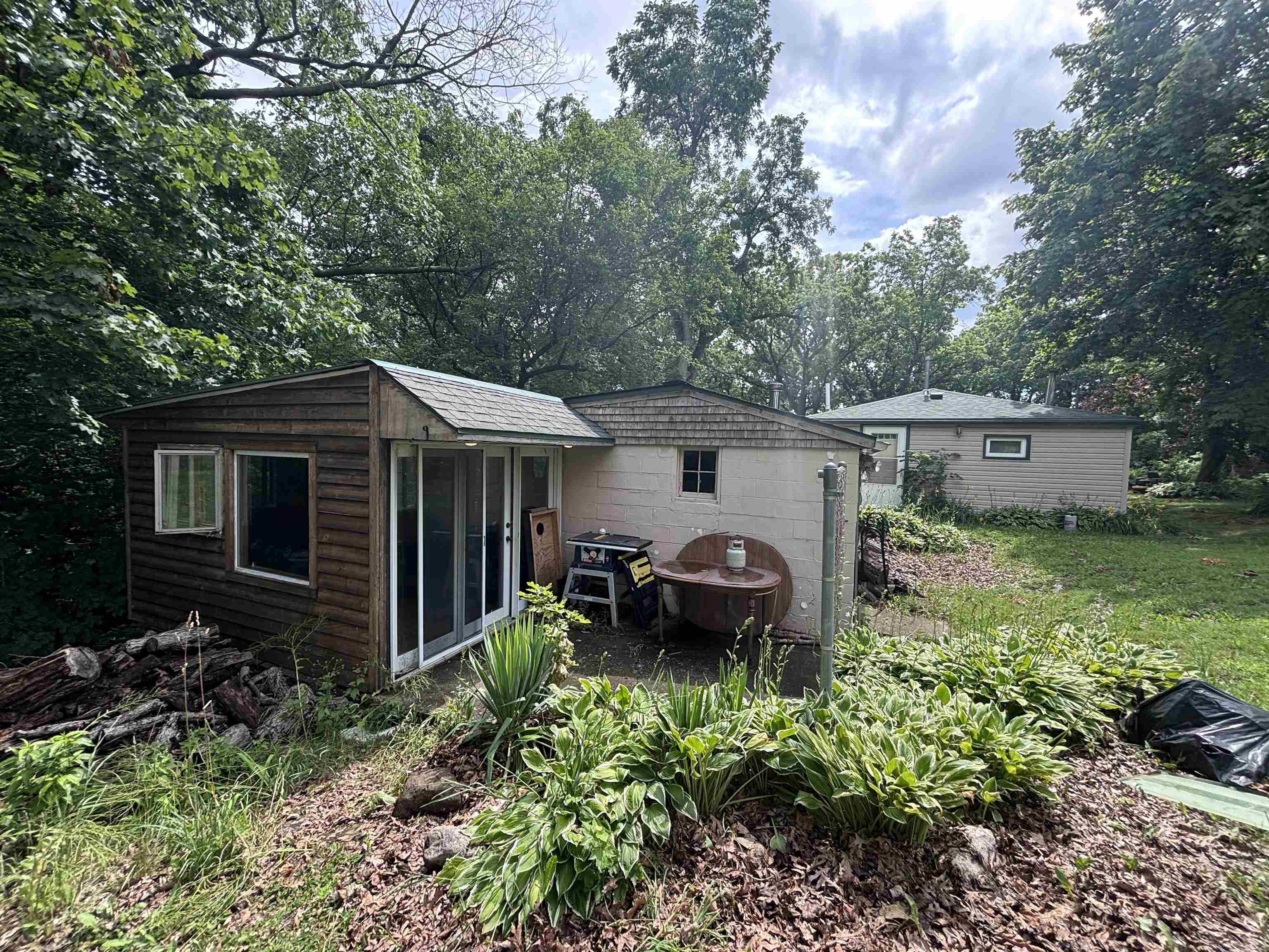 3543 Mill Road Cherry Valley, IL 61016 - Photo 39 of 46 a backyard of a house with garden yard and outdoor seating