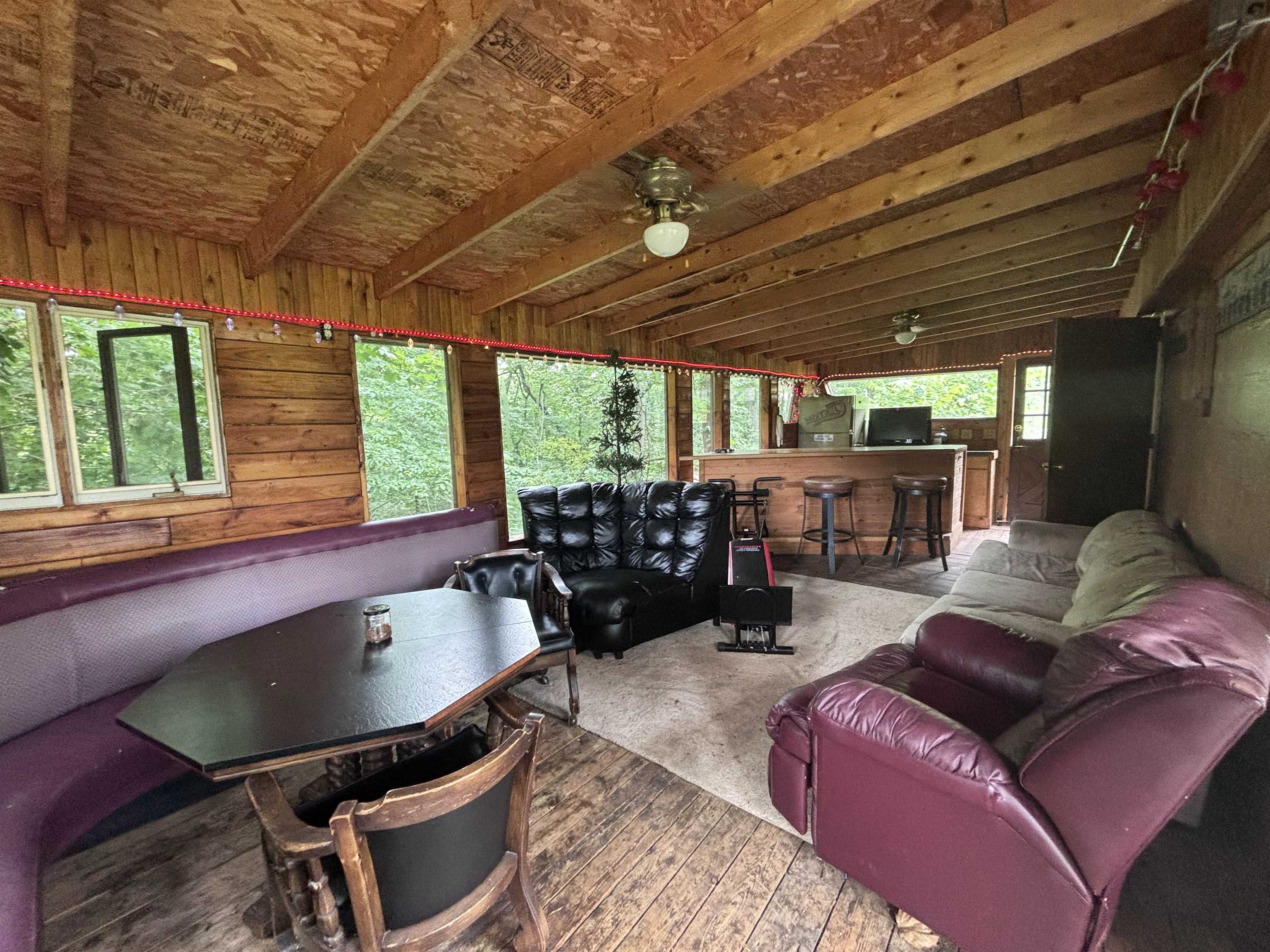 3543 Mill Road Cherry Valley, IL 61016 - Photo 41 of 46 a living room with furniture a flat screen tv and a large window