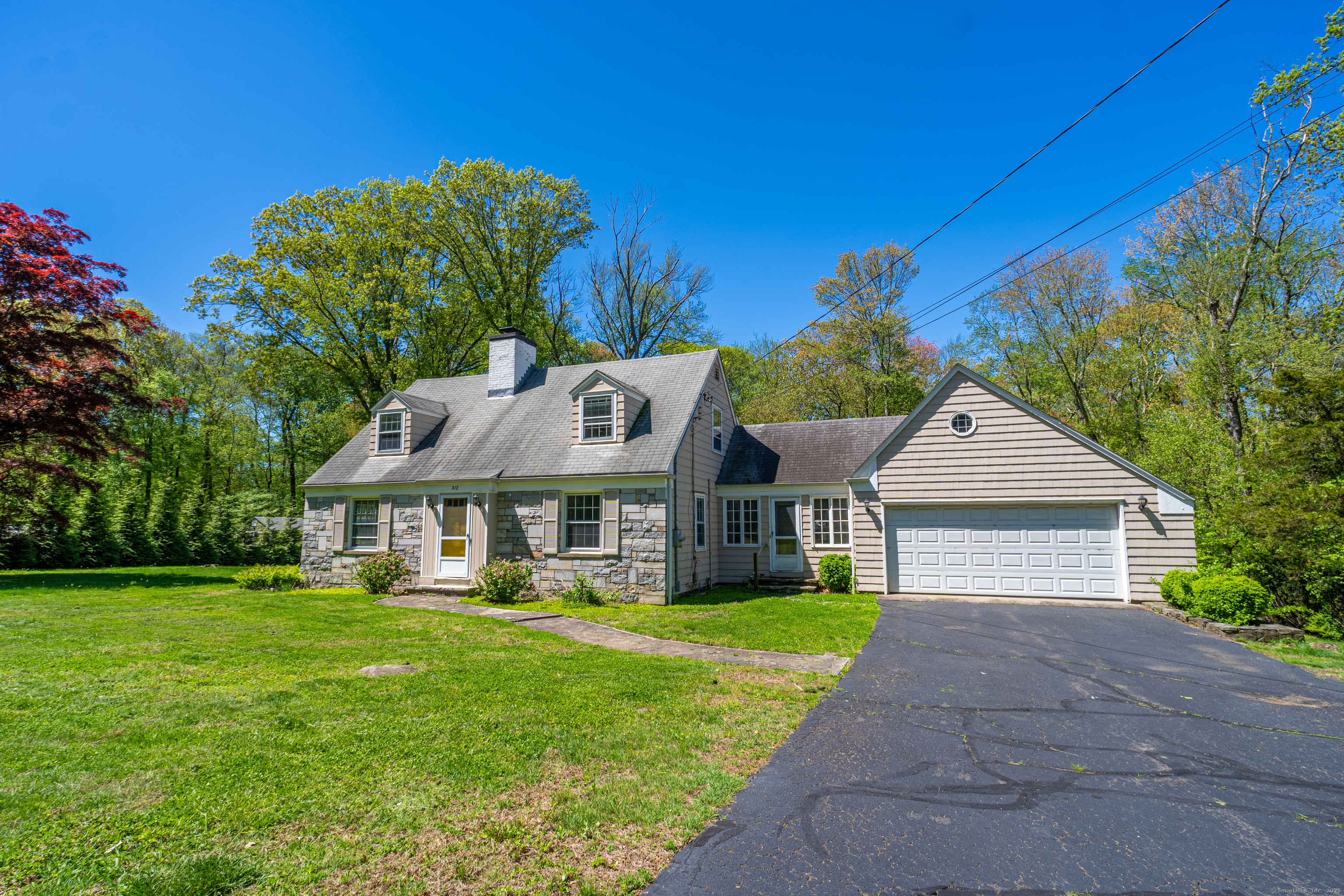 312 Fairlea Road Orange, CT 06477 - Photo 1 of 1 a front view of a house with garden