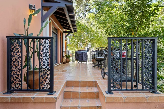 a kitchen with granite countertop a stove a sink and a refrigerator