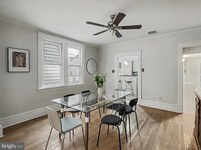a view of a dining room with furniture and window