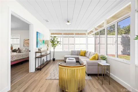 a bedroom with furniture and a window
