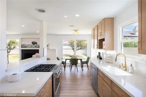 a kitchen with a dining table and appliances