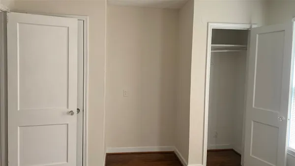 a view of front door with wooden floor
