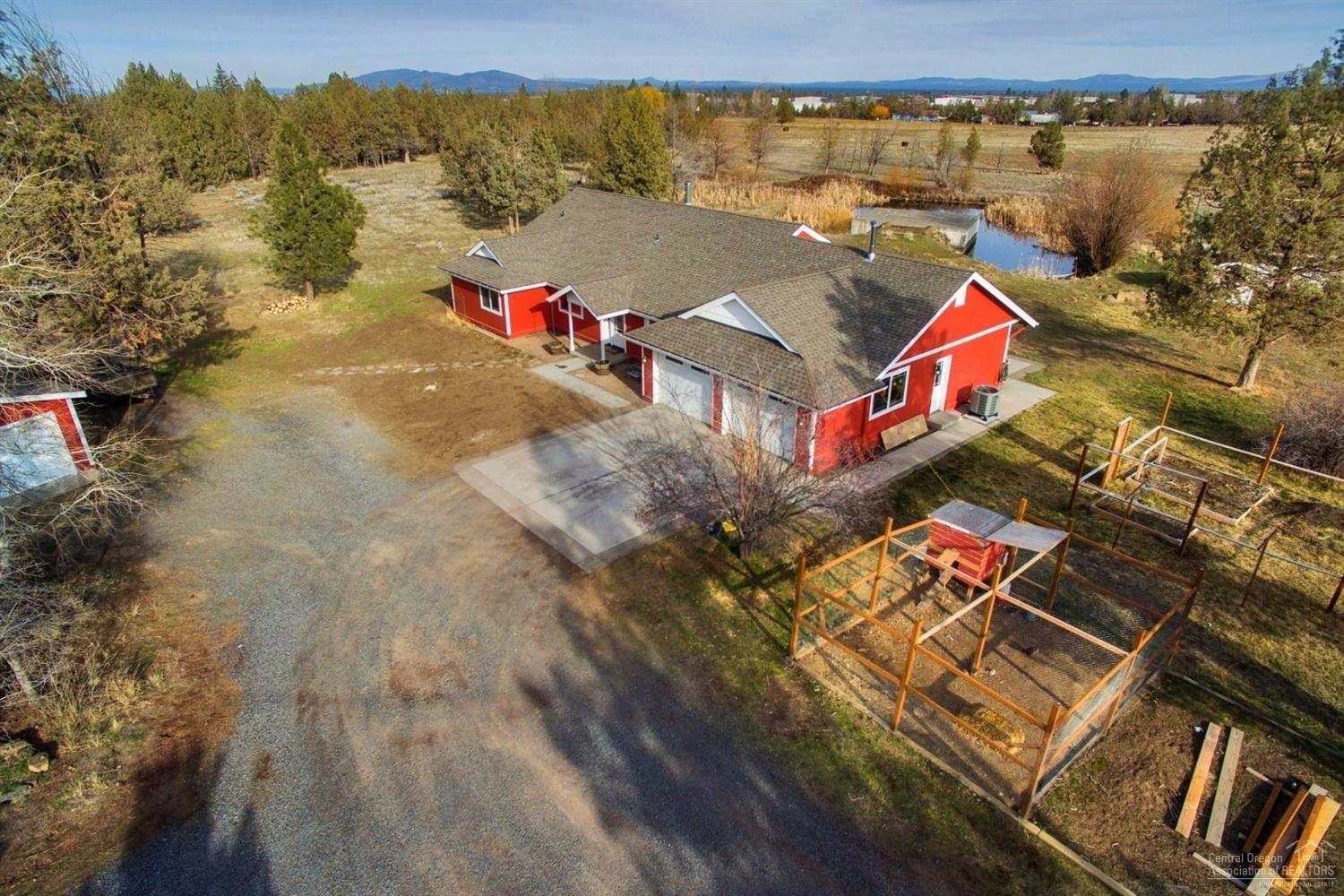 22224 Nelson Road Bend, OR 97701 - Photo 1 of 19 an aerial view of a houses with a lake view