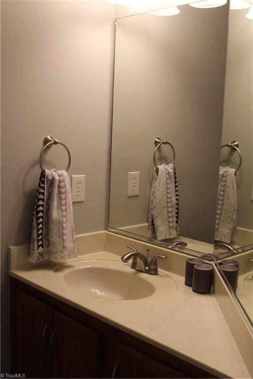 5902 High View Road Greensboro, NC 27410 - Photo 13 of 30 Down stairs half bath with new fixtures.