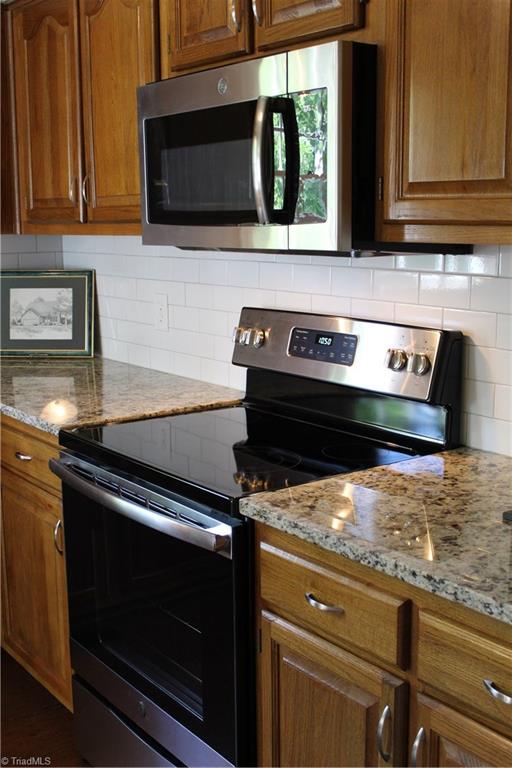 5902 High View Road Greensboro, NC 27410 - Photo 18 of 30 Beautiful granite countertop. New range and MW