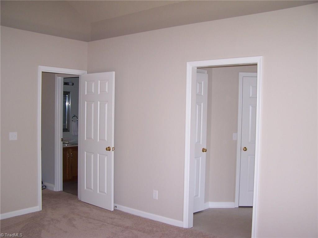 5902 High View Road Greensboro, NC 27410 - Photo 26 of 30 Master bedroom with extended shelf