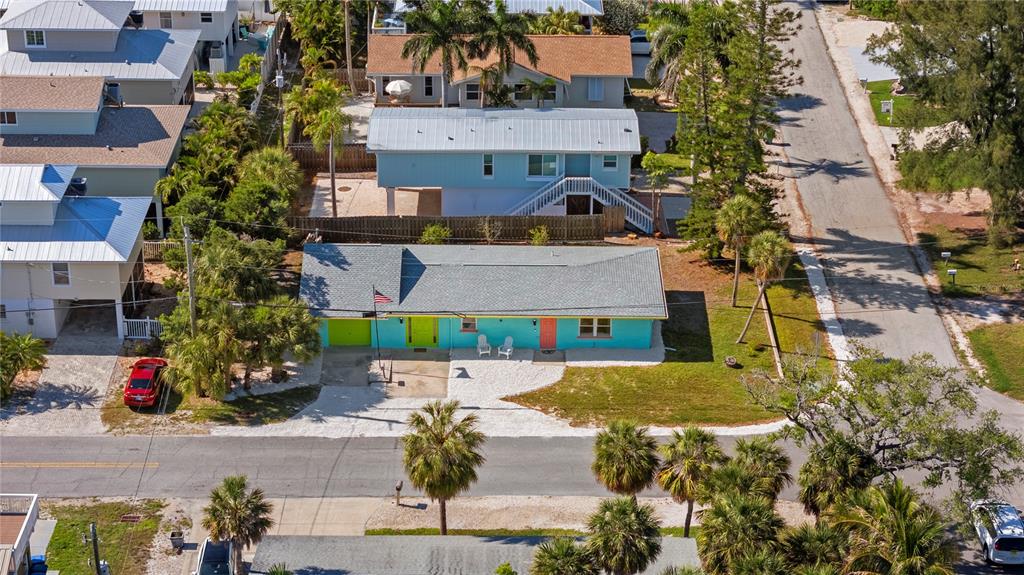 204 29th Street Holmes Beach, FL 34217 - Photo 1 of 38 an aerial view of multiple houses with a yard