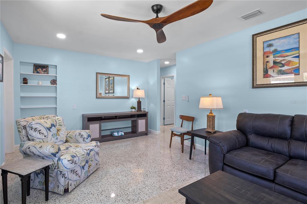 204 29th Street Holmes Beach, FL 34217 - Photo 12 of 38 a living room with furniture a couch and a piano