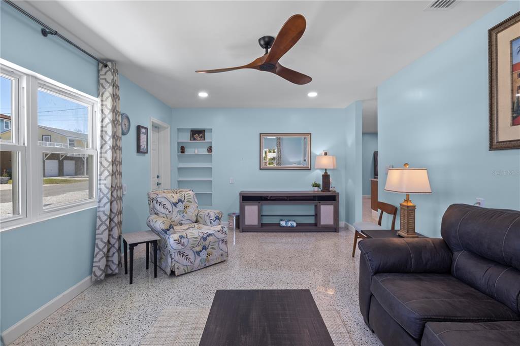 204 29th Street Holmes Beach, FL 34217 - Photo 13 of 38 a bedroom with furniture and a chandelier