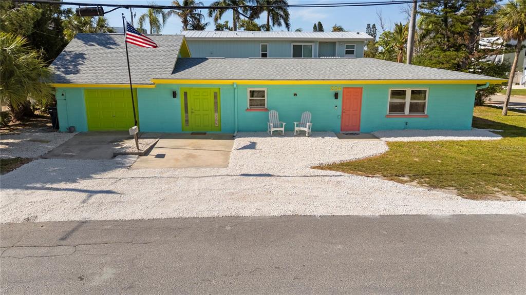 204 29th Street Holmes Beach, FL 34217 - Photo 3 of 38 a view of a house with a yard and sitting area