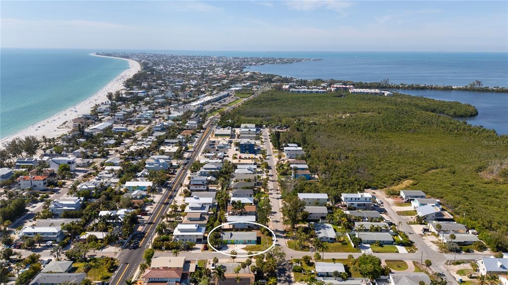204 29th Street Holmes Beach, FL 34217 - Photo 33 of 38 an aerial view of residential houses with outdoor space