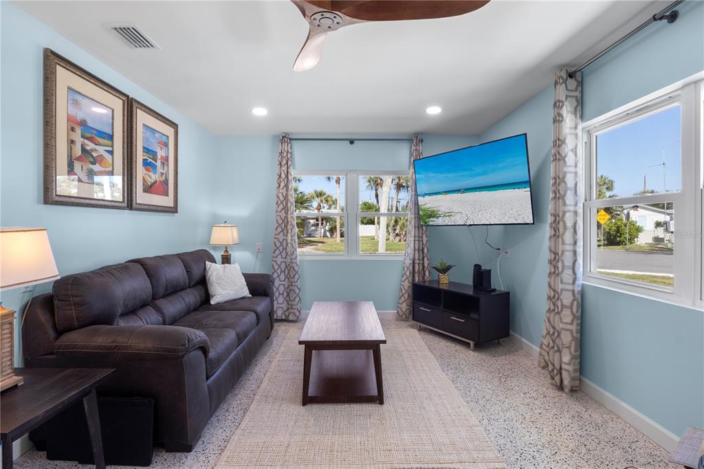 204 29th Street Holmes Beach, FL 34217 - Photo 9 of 38 a living room with furniture and a large window