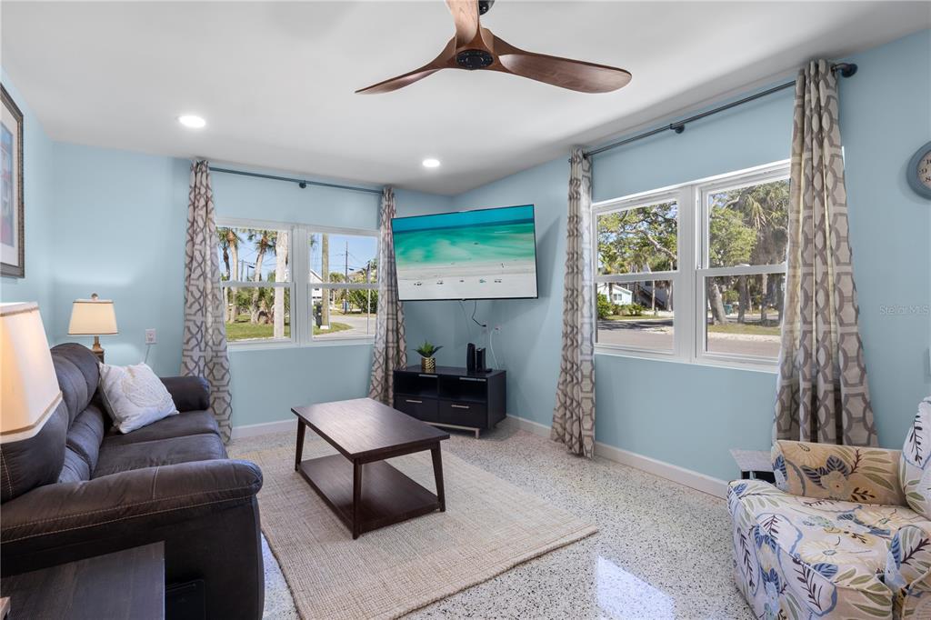 204 29th Street Holmes Beach, FL 34217 - Photo 10 of 38 a living room with furniture and a window