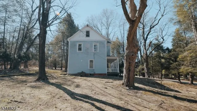 a view of empty space with large trees