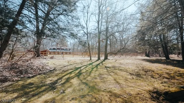 a view of a backyard with white house