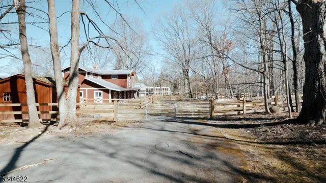 a view of a yard with snow on the road